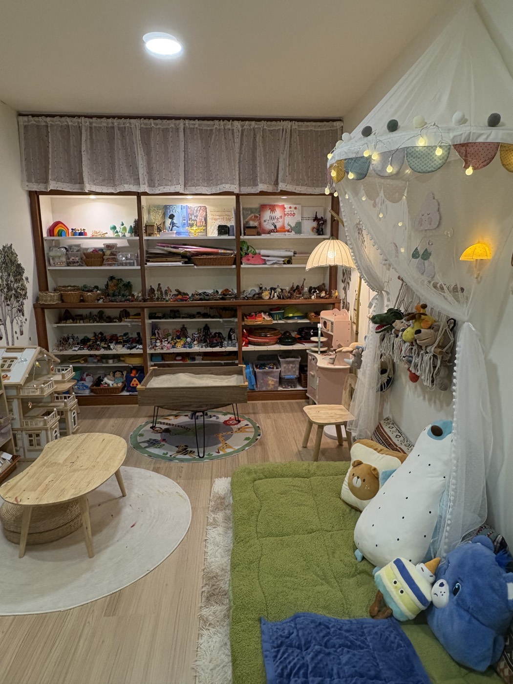Play therapy room with toys, sand tray and child-friendly seating